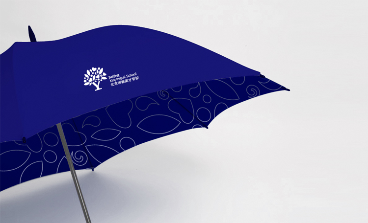 新英才学校蓝色大树logo品牌雨伞礼品，锦连环VI系统设计