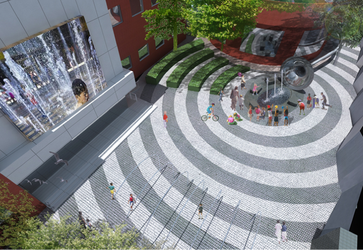 田村中心小学圆形铺装广场俯拍实景,同心圆地面构成校园环境建设亮点